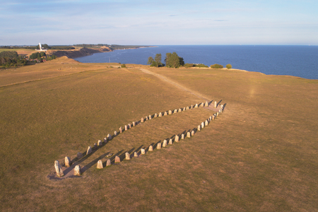 Aerial view of the stone ship Ales stones formed by 59 large boulders and 67 m long located at Kaseberga  in the Swedish province of Scania.の写真素材