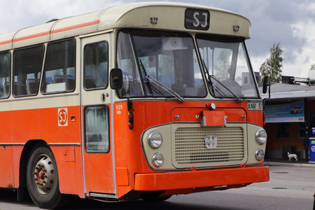 Mariefred, Sweden - August 7, 2016: Old timer Volvo public transportation bus in orange color as it look like in service for SJ during the 1980sのeditorial素材