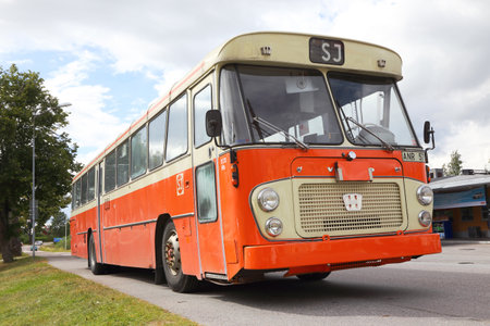 Mariefred, Sweden - August 7, 2016: Former SJ bus Volvo model B58 year 1970 with body made of Hagglund and sons painted in 1986 color scheme (orange and marked with SJ).のeditorial素材