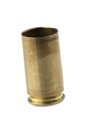 Used 9 mm cartridge case isolated on white.