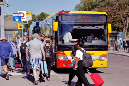 Kalmar, Sweden - June 28, 2018: Passengers at the Kalmar central station enter the public transportation bus with destination Byxelkrok via Borgholm on the Oland island.のeditorial素材