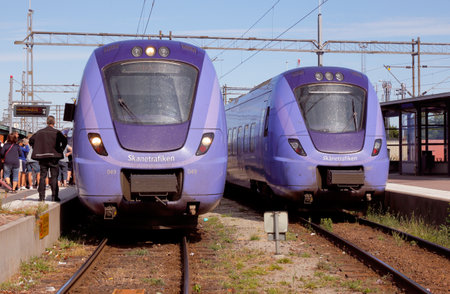 Ystad, Sweden - June 26, 2018: Two blue public transportation train class X61 in service for Skanetrafiken at Ystad railroad station.のeditorial素材