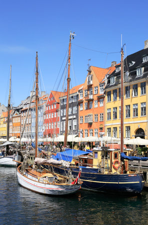 Copenhagen, Denmark - June 27, 2018: View of the Nyhavn area with nautical vessels in the forground.のeditorial素材