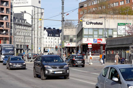 Sundbyberg, Sweden - May 3, 2016: Traffic on the street Landsvagen near Ballstabro in downtown Sunbyberg.のeditorial素材
