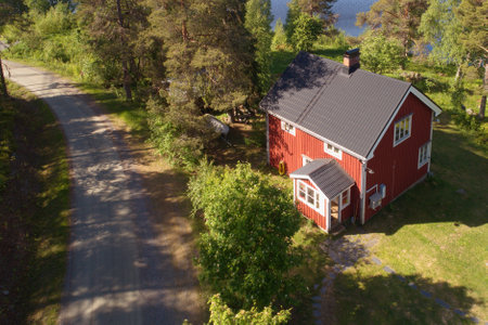 Ranea, Sweden - June 17, 2018: Aerial view of a red two stories one family residential wooden house constructed during the 1930s.のeditorial素材