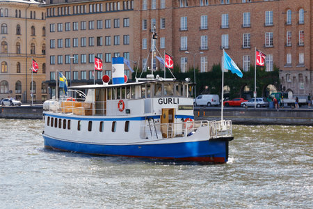 Stockholm, Sweden - July 12, 2018: Public transportation, SL, boat service on line 80 with destination Frihamnen at Nybroviken in Stockholm city center.のeditorial素材