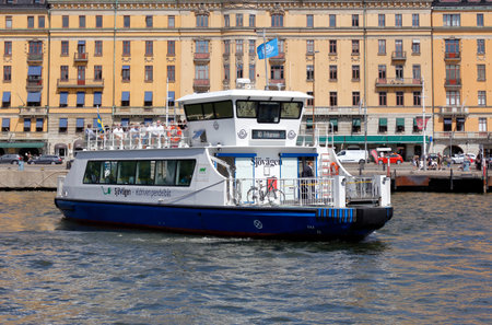 Stockholm, Sweden - July 12, 2018: The electric powered shuttle public transportation ferry Sjovagen in service on line 80 for SL, has departured from the Nybokajen stop with destination Frihamnen.のeditorial素材