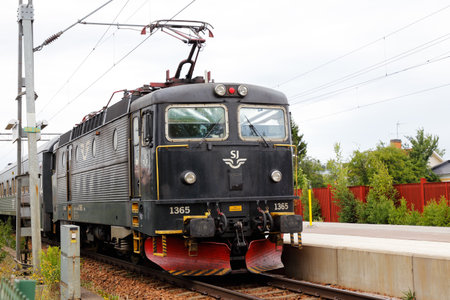 Arboga, Sweden - July 9, 2018: A black electric locomotive class Rc6 number 1365 operated by SJ at the Arboga railroad station.のeditorial素材