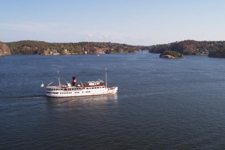 Lidingo, Sweden - July 31, 2018: Aerial view of the old passenger steam ship SS Stockholm in service for Stromma heading for Stockholm at Skurusundet.のeditorial素材