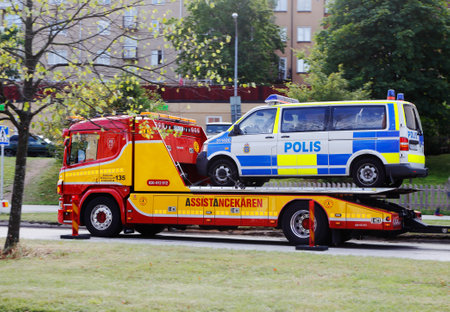 Solna, Sweden - August 31, 2016: Swedish police car loaded on a salvage truck.のeditorial素材