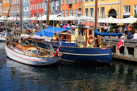Copenhagen, Denmark - June 27, 2018: View of wooden ships in the Nyhavn district.のeditorial素材
