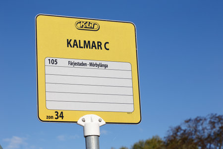 Kalmar, Sweden  - August 22, 2017: Yellow bus stop sign for the public transportatin in the Kalmar county, at the central station with destinations on the Oland island.のeditorial素材