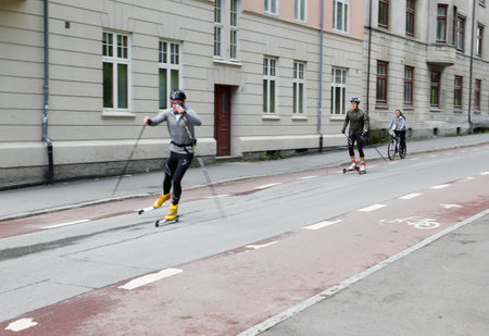 Trondheim, Norway - September 26, 2015: Two males on rollerskis near the university.のeditorial素材