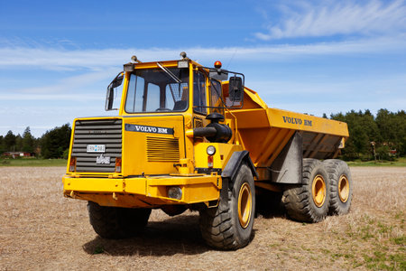 Enhorna, Sweden - June 6, 2018: An yellow painted articulated hauler VOLVO BM 5350 6X6 produced 1987.のeditorial素材