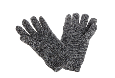 One pair of grey knitted textile gloves isolated on white background.の写真素材
