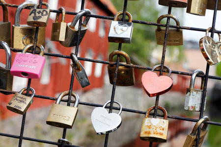 Vasteras, Sweden - May 20, 2017: A bridge fence with pad locks as a symbol of love.のeditorial素材