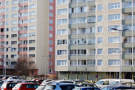 Sodertalje, Sweden - February 24, 2019: Exterior view of multi-family multy-stories apartment buildings 1960s era with parked cars in front in the Brunssang district.のeditorial素材