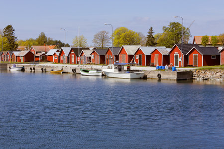 Kappelshamn, Sweden - May 13, 2016: Fishing sheds in the Kappelshamn harbor.のeditorial素材