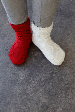 Close up of the feet wearing socks in different color on each foot.の写真素材