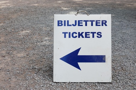 Portable sign with an arrow annonces were tickes can be bought bouth in Swedish and English.の写真素材