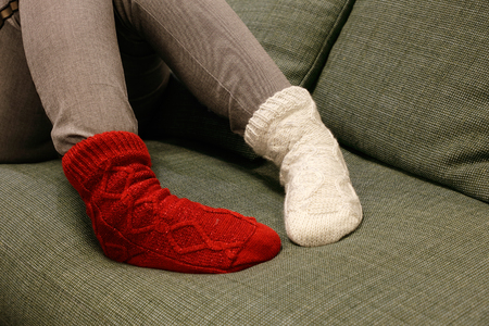 Close up of the feet wearing socks in different color on each foot.の写真素材