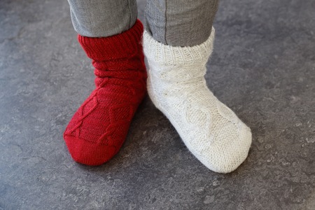 Close up of the feet wearing socks in different color on each foot.の写真素材