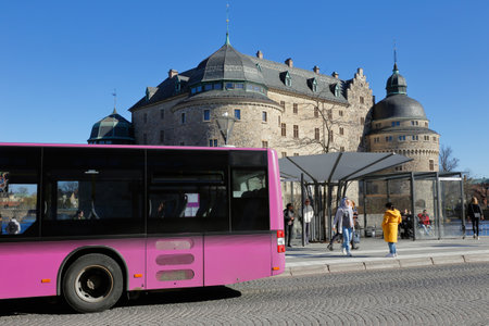 Orebro, Sweden - April 17, 2019: One violet public transportation city bus in front of the Orebro...