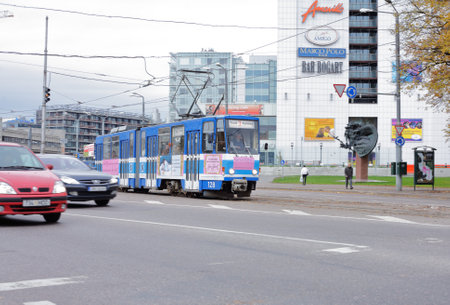 Tallinn, Estonia - October 26, 2006: Blue articuated public transportation tram in the downtown district.のeditorial素材