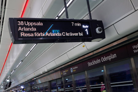 Stockholm, Sweden - September 8, 2017: Destination sign at commuter railroad station Stockholm Odenplan with train for Uppsala via Arlanda airport.のeditorial素材