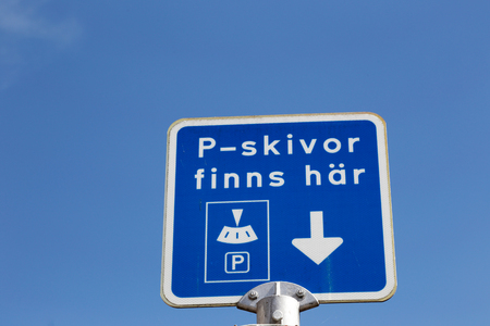 Sign with text n Swedish with information were parking discs can be collected.の写真素材