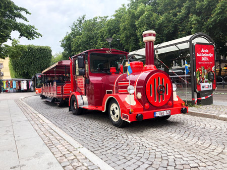 Karlstad, Sweden - June 14, 2019: A red Dotto train in the city center on sightseeing tour.のeditorial素材