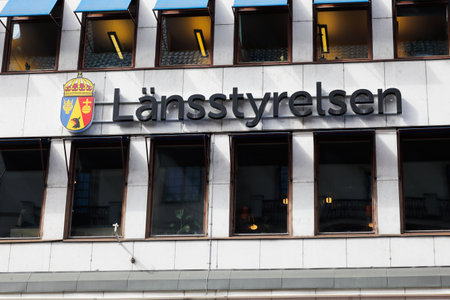 Stockholm, Sweden - June 10, 2019: The Stockholm County Administrative Board sign with its coat of arms located at the the Kungsgatan street office building.のeditorial素材