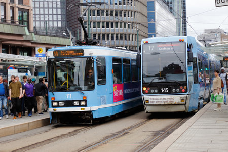 Oslo, Norway - June 20, 2019: Two trams at the Jernbanetorget stop.のeditorial素材