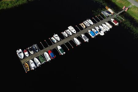 Aerial view of a jetty with moored pleasure boats.の写真素材