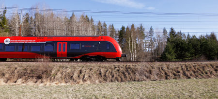 Molnbo, Sweden - May 3, 2017: Side view of a red MTR Express train class X74.