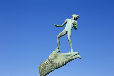 Eskilstuna, Sweden - September 13, 2019: The  Hand of God (Swedish, Guds hand) by the sculptur Carl Milles, located near the river for public viewing.のeditorial素材
