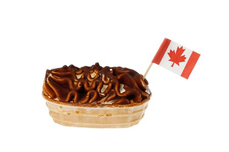 Cocholoate covered ice cream boat with a Canadian flag isolated on white background.
