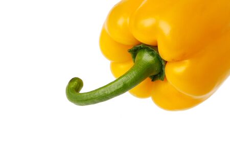 Close up of an ripe yellow pepper isolated on white background.の写真素材