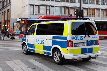 Stockholm, Sweden -   January 20, 2020: Rear and side view of a Swedish Volkswagen make police van in downtown Stockholm.のeditorial素材