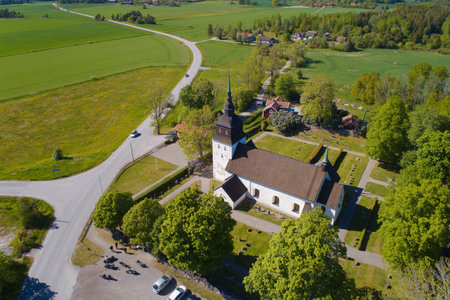 Vanso, Sweden - May 30, 2020: Aerial view of the Vanso church building, first constructed during the end of the 12th century.のeditorial素材