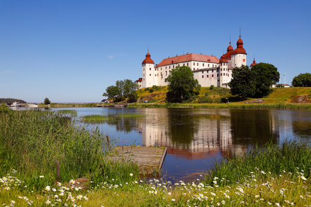 Summer at the medieval Lacko castle located in Swedish province of Vastergotland.のeditorial素材