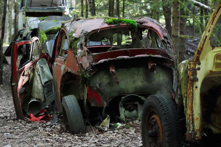 Old cars out of order left in a car cemetery.の写真素材
