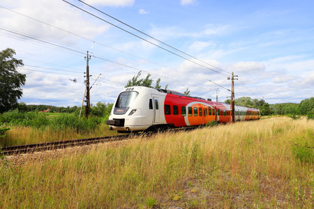 Norsholm, Sweden - July 3, 2020: One multiple unit elctrial train class X61 in service for Ostgotapendeln.のeditorial素材