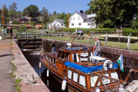 Haverud, Sweden - June 24, 2020: Locking is ongoing in Dalsland's canal at the lock aera in Haverud.のeditorial素材
