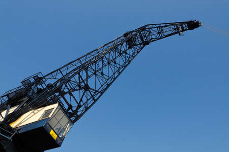 Low angle view of an old harbor crane.の写真素材
