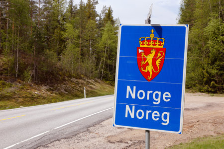 Norway, Sweden - May 26, 2016: Norwegian international border road sign located at the border with Sweden.のeditorial素材