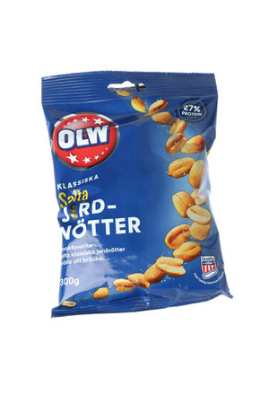 Stockholm, Sweden - March 7, 2021: One package of the OLW brand salted peanuts 300 g roasted American peanuts isolated on white background for the Swedish market.のeditorial素材