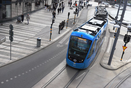 Stockholm, Sweden - April 30, 2021. High angle view of an articulated modern tram at the Sergelstorg square in the downtown district.のeditorial素材