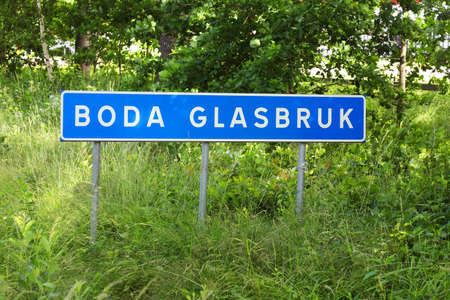 Road sign with the Swedish village Boda Glasbruk name printed in the province of Smaland.の写真素材