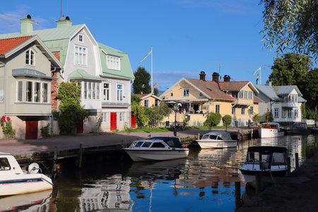 Trosa, Sweden - August 8, 2021: View of the builings and pleasure boats  alongside the Trosa river.のeditorial素材